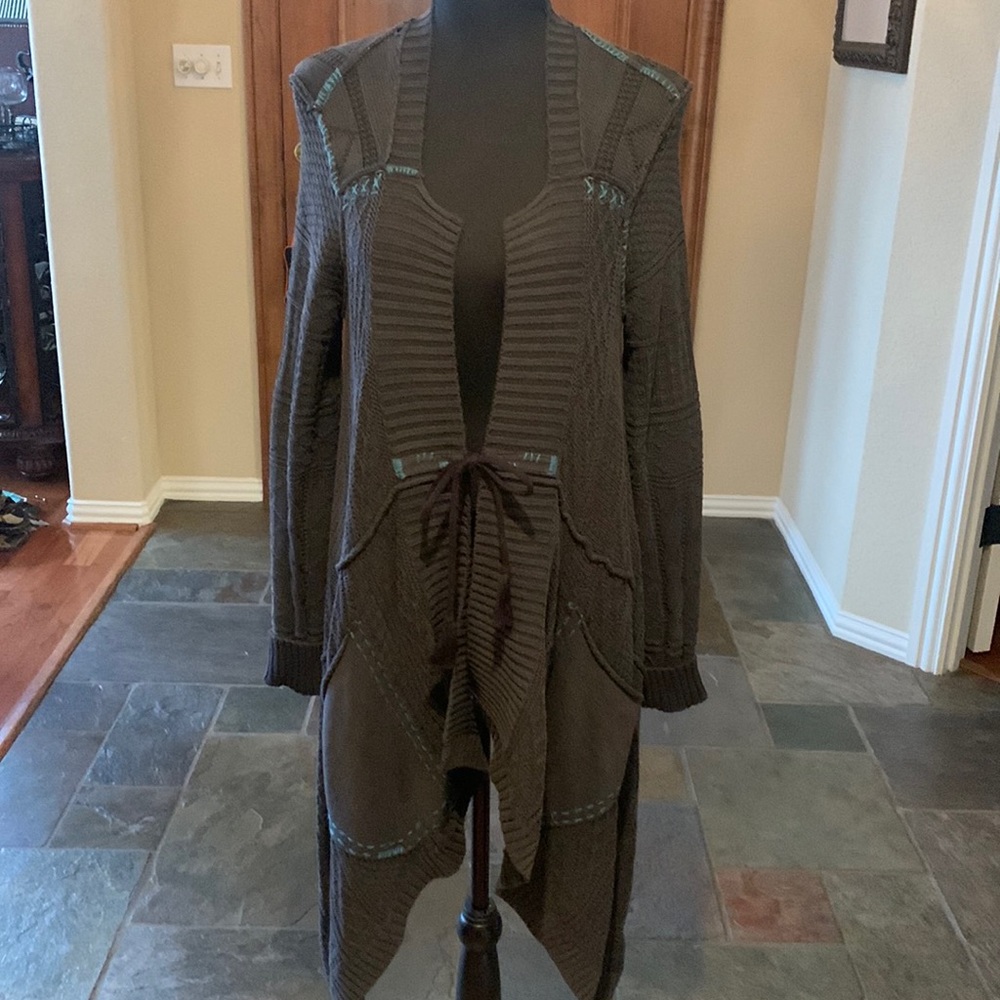 Beautiful charcoal grey sweater by Idyllwind w/turquoise accents.Longer on sides